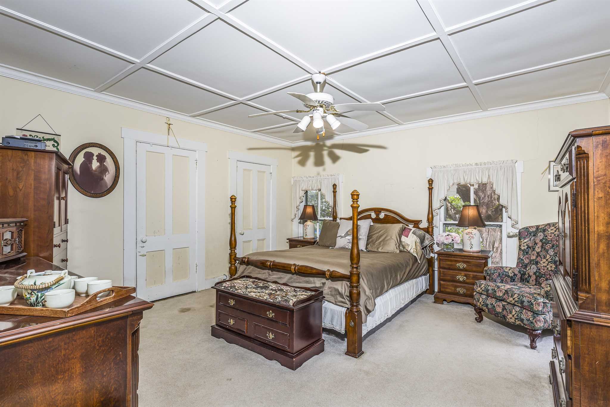 22 Pine Street Pine Plains, NY 12567 - Photo 20 of 25 a bedroom with bed and a chandelier