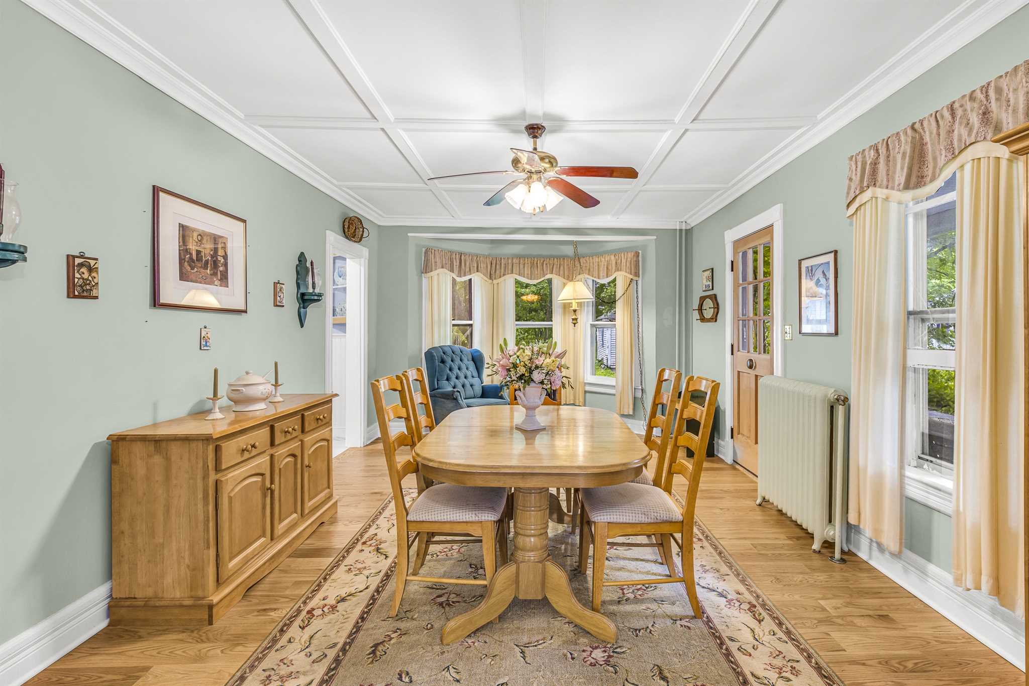 22 Pine Street Pine Plains, NY 12567 - Photo 8 of 25 a dining room with furniture a rug and a chandelier