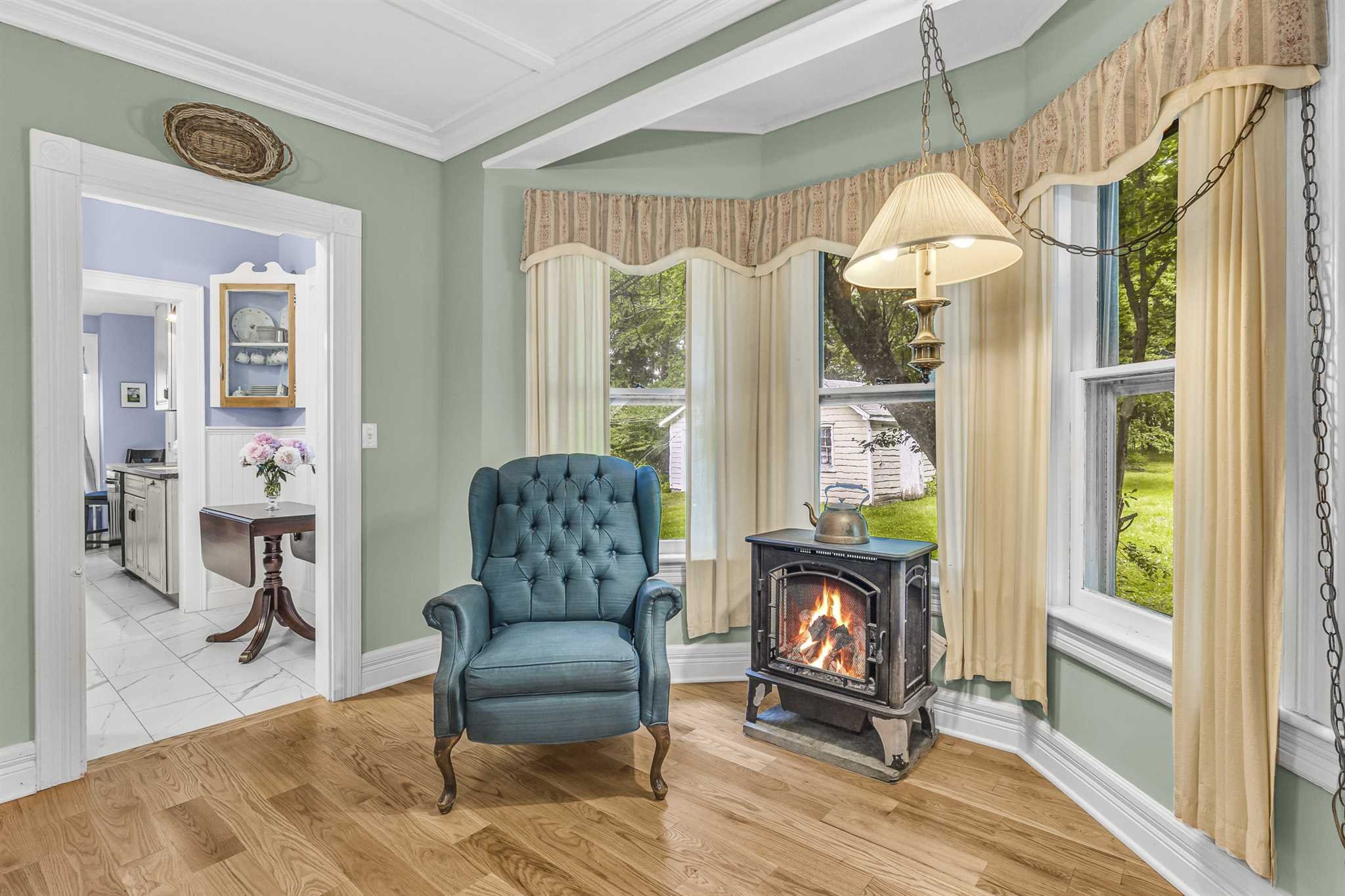22 Pine Street Pine Plains, NY 12567 - Photo 10 of 25 a living room with furniture a fireplace and a floor to ceiling window