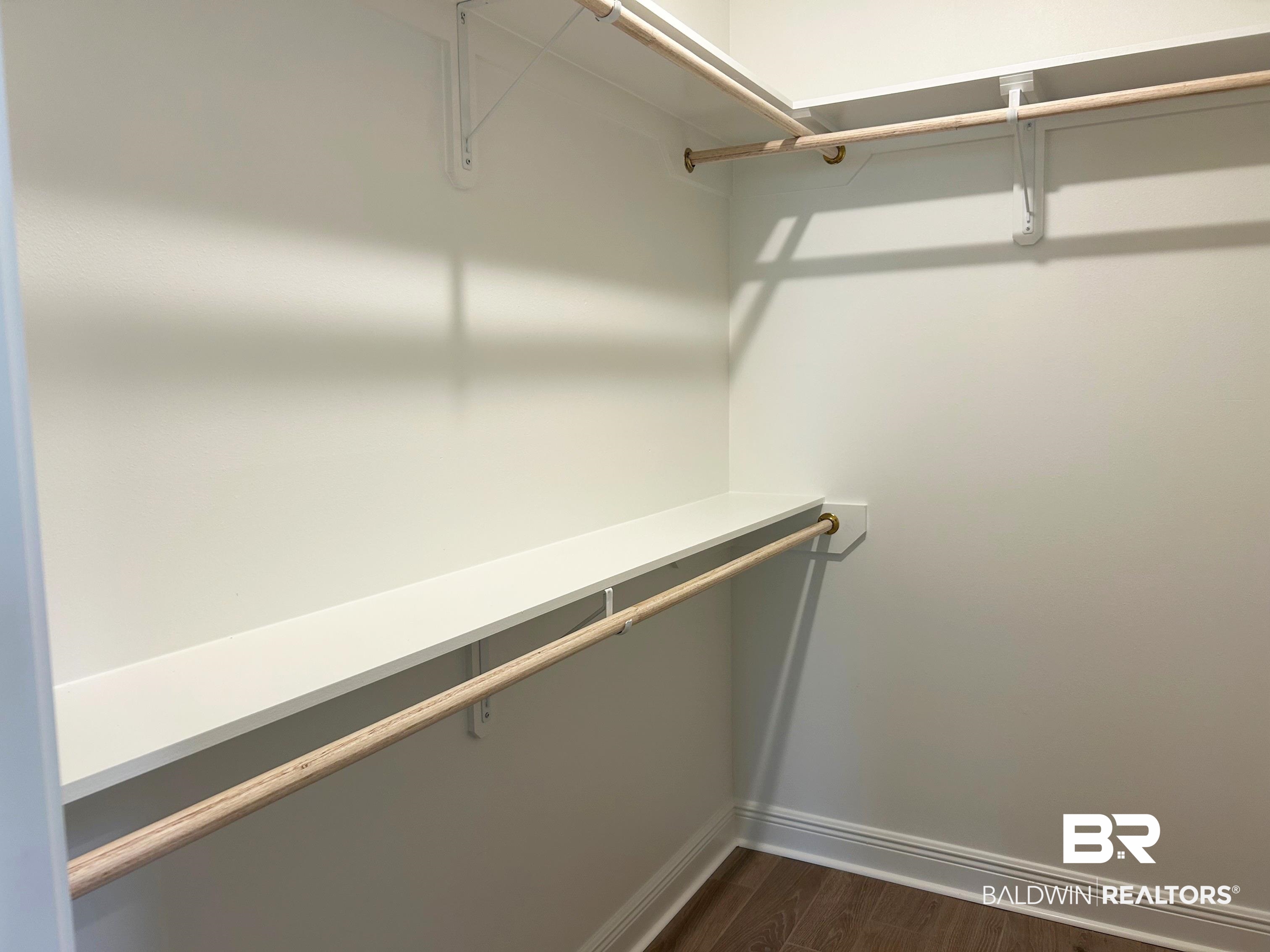 869 Sumter Loop Foley, AL 36535 - Photo 17 of 24 Walk in closet featuring dark wood-style floors