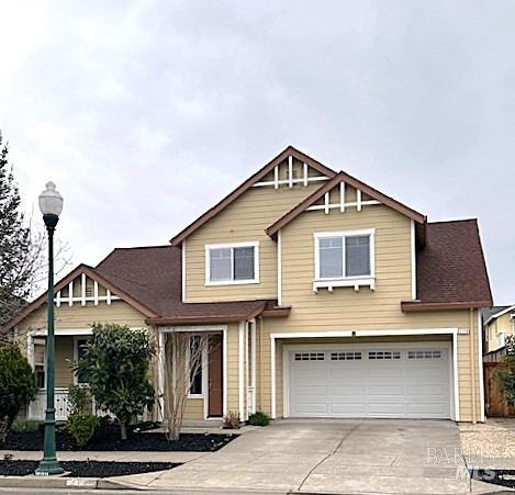 a front view of a house with a garage