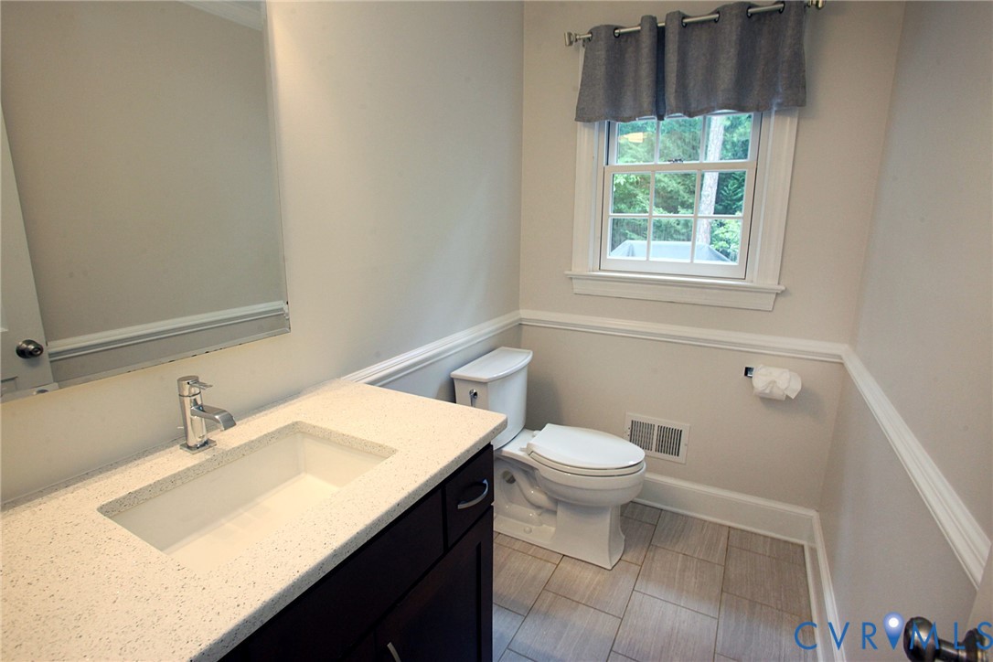 231 Hazelmere Drive Chesterfield, VA 23236 - Photo 16 of 33 a bathroom with a sink a toilet and a window