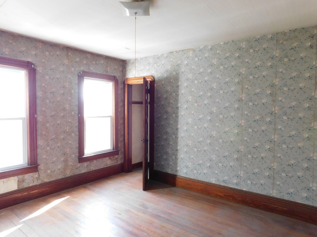 44-46 Langdon Street Springfield, MA 01104 - Photo 14 of 30 an empty room with wooden floor and windows