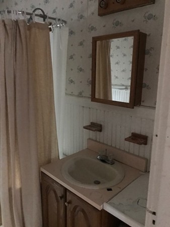 44-46 Langdon Street Springfield, MA 01104 - Photo 20 of 30 a bathroom with a sink and a mirror