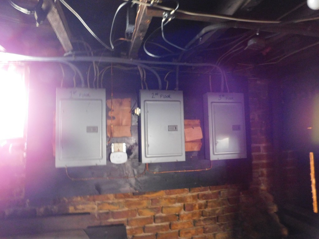 44-46 Langdon Street Springfield, MA 01104 - Photo 23 of 30 a view of water heater room with wooden floor