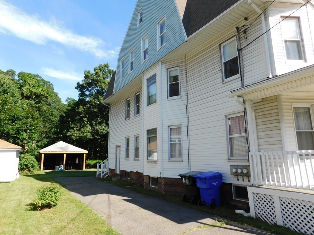 44-46 Langdon Street Springfield, MA 01104 - Photo 29 of 30 a front view of a house with a yard