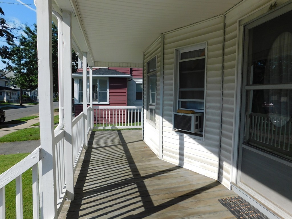 44-46 Langdon Street Springfield, MA 01104 - Photo 30 of 30 a view of a balcony with wooden floor and floor to ceiling window