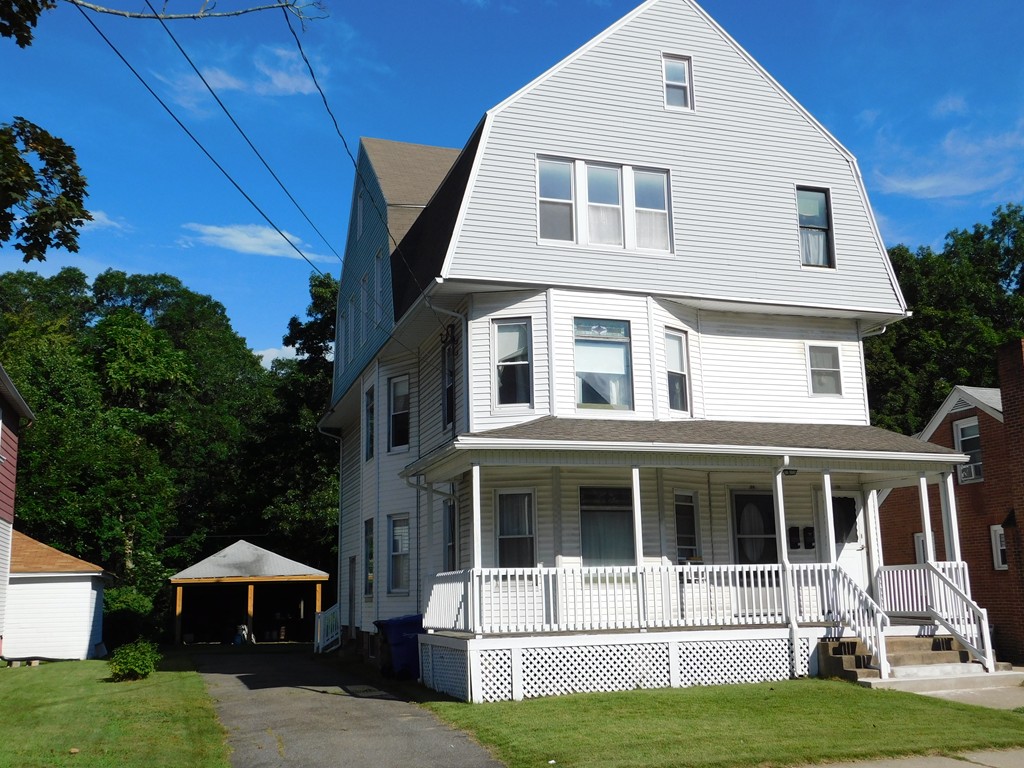 44-46 Langdon Street Springfield, MA 01104 - Photo 3 of 30 a front view of a house with a yard