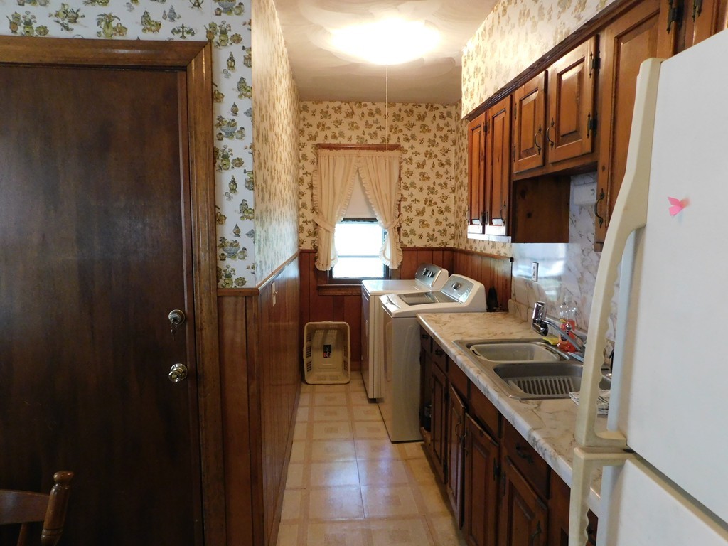 44-46 Langdon Street Springfield, MA 01104 - Photo 4 of 30 a kitchen with a sink and a refrigerator