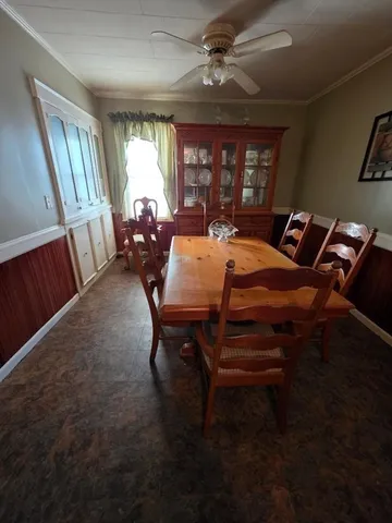 a kitchen with a sink a stove cabinets and a counter top space