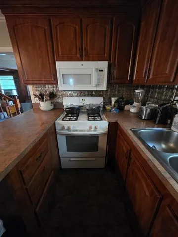 a bedroom with a bed and a television