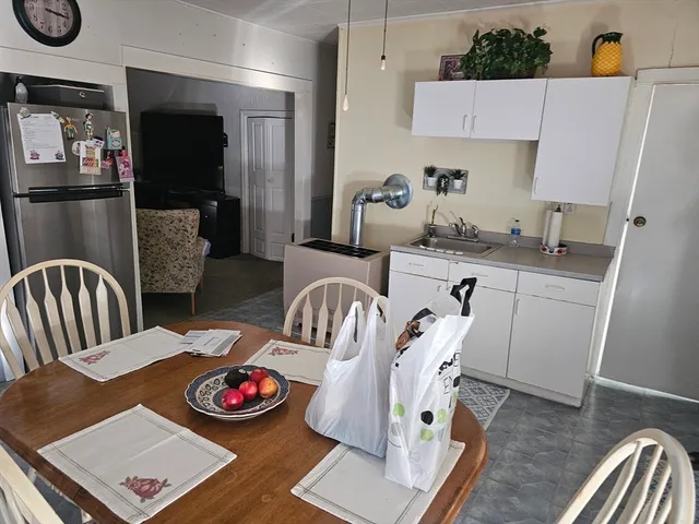 a bedroom with a bed and dresser