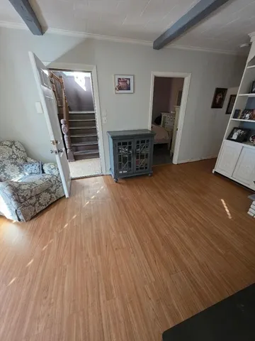 a view of a livingroom with furniture and wooden floor