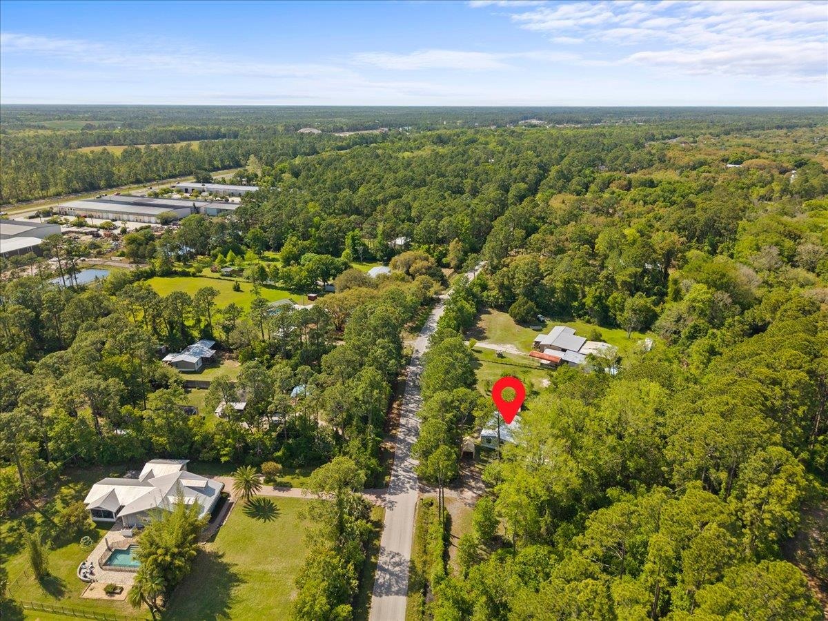 6860 Catlett Road St. Augustine, FL 32095 - Photo 34 of 36 Drone / aerial view of a heavily wooded area and a large body of water
