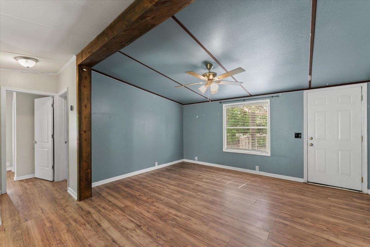 6860 Catlett Road St. Augustine, FL 32095 - Photo 5 of 36 Unfurnished room with wood finished floors, a ceiling fan, and lofted ceiling