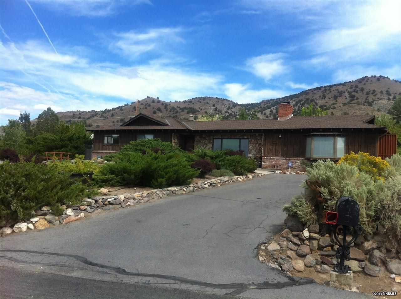 14010 Rim Rock Drive Reno, NV 89521 - Photo 1 of 1 a view of a house with a street