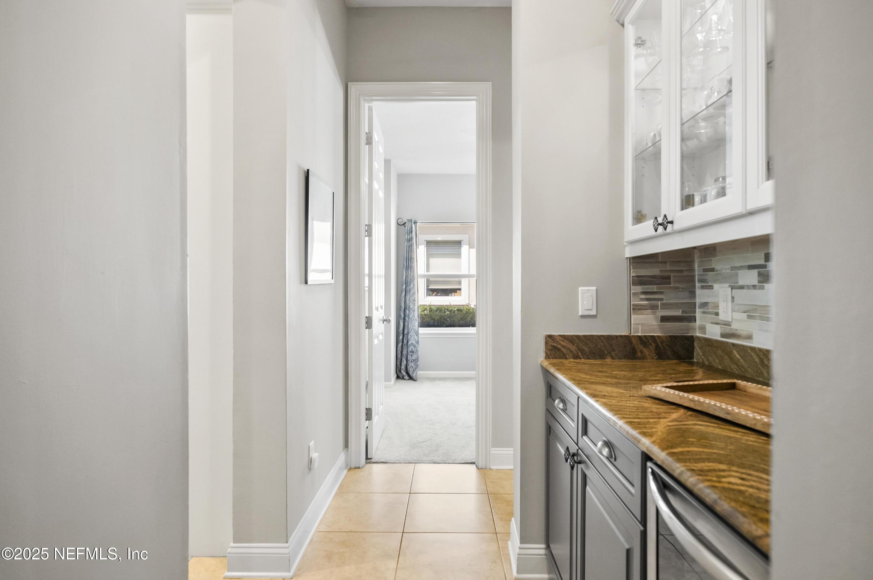 649 Treehouse Circle St. Augustine, FL 32095 - Photo 36 of 207 Butlers Pantry with Backsplash