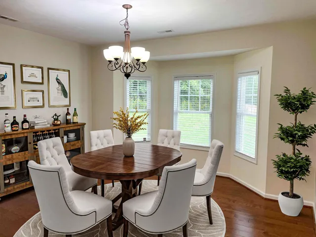 a view of a dining room with furniture window and wooden floor