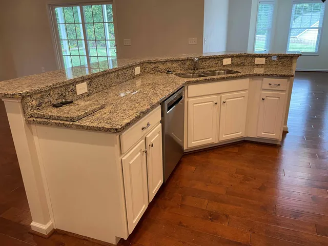 a kitchen with granite countertop granite top and a sink