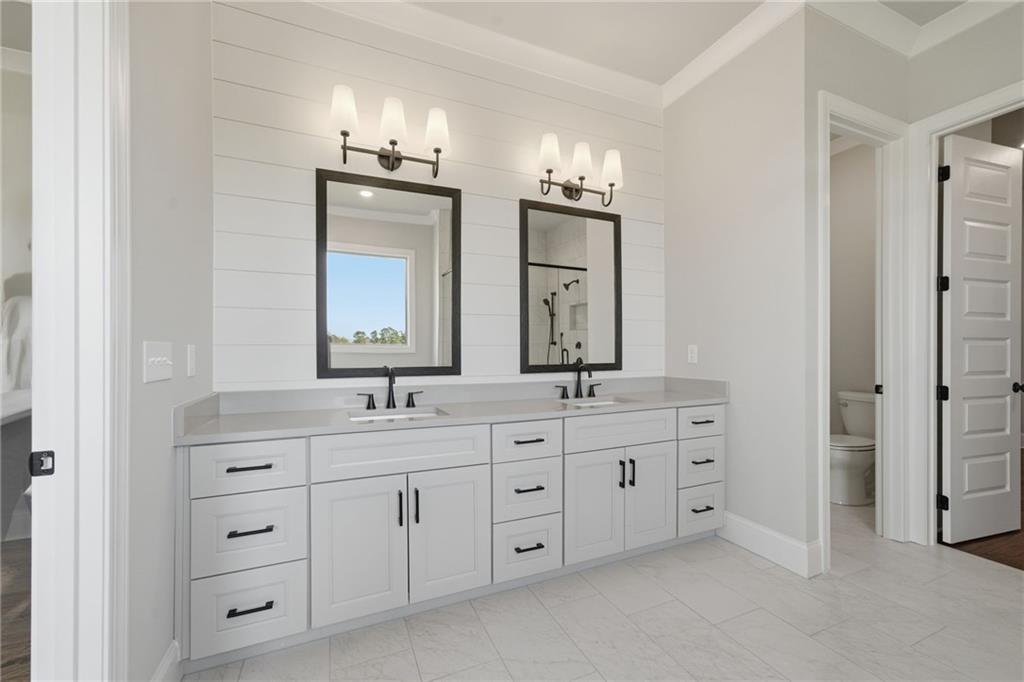 5364 Price Road Gainesville, GA 30506 - Photo 40 of 59 a bathroom with a double vanity sink and a mirror