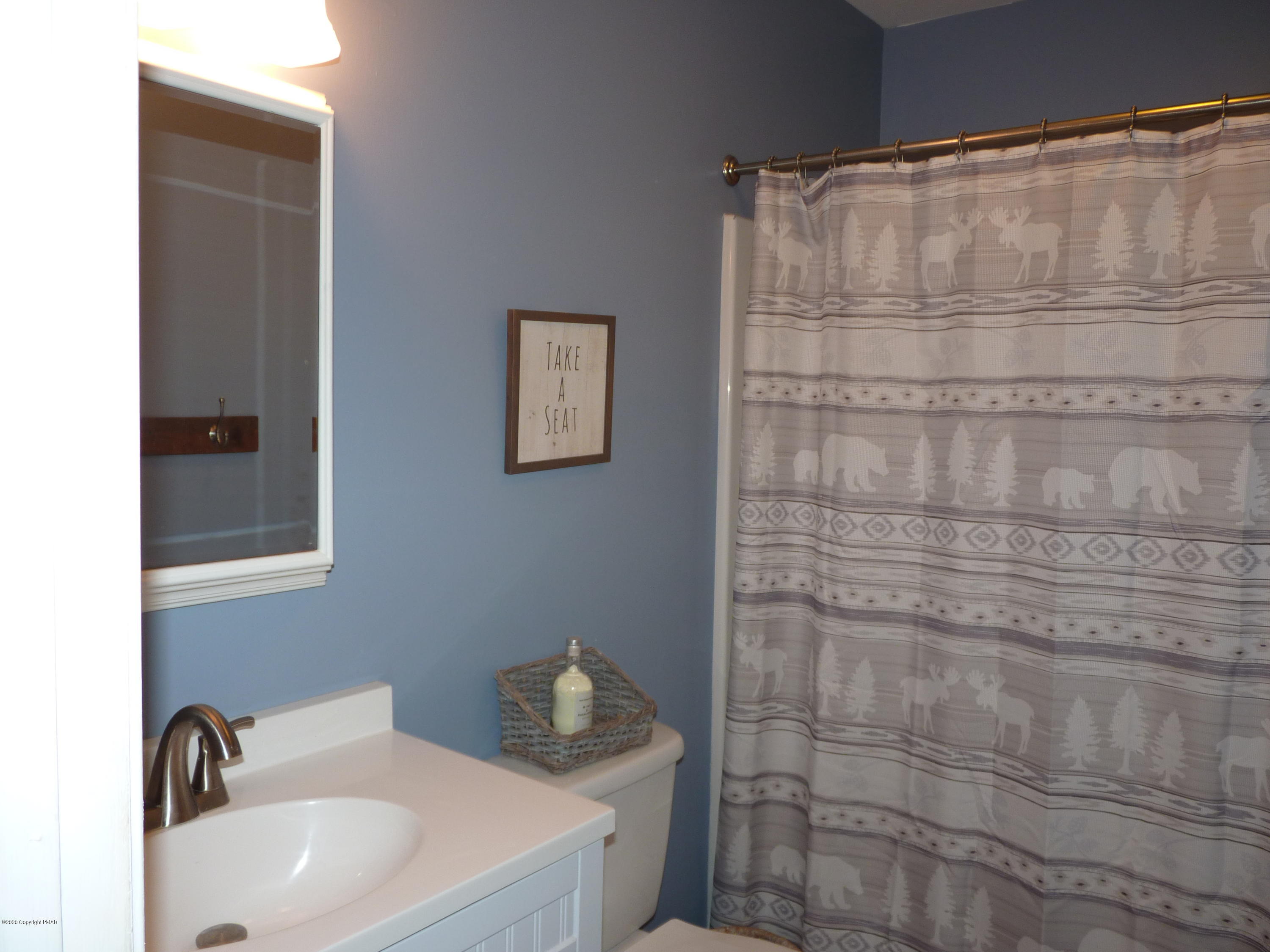 139 Fern Ridge Road Blakeslee, PA 18610 - Photo 12 of 19 a bathroom with a sink and shower