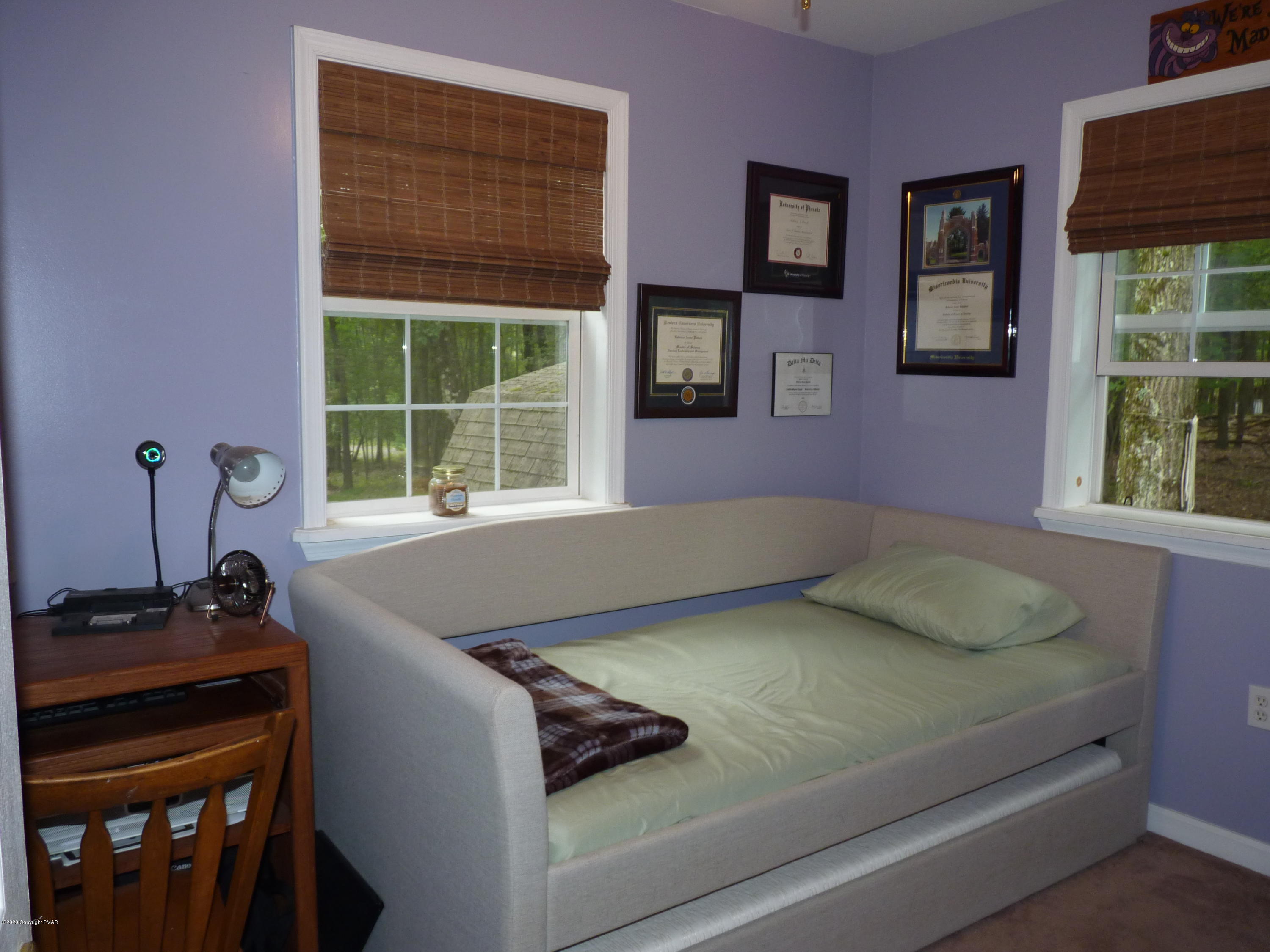 139 Fern Ridge Road Blakeslee, PA 18610 - Photo 13 of 19 a room with a bed and windows