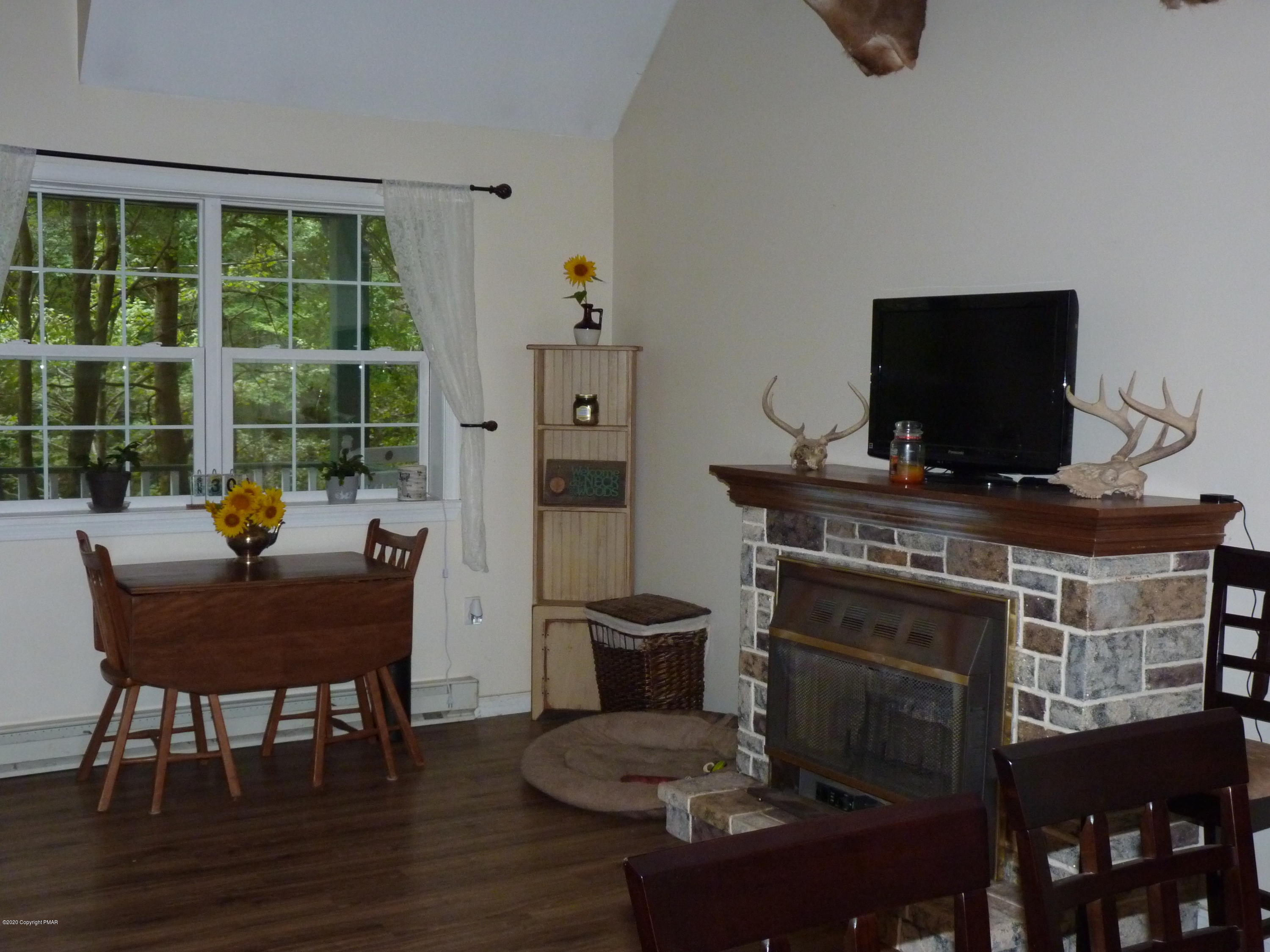 139 Fern Ridge Road Blakeslee, PA 18610 - Photo 4 of 19 a view of a workspace with furniture and a window