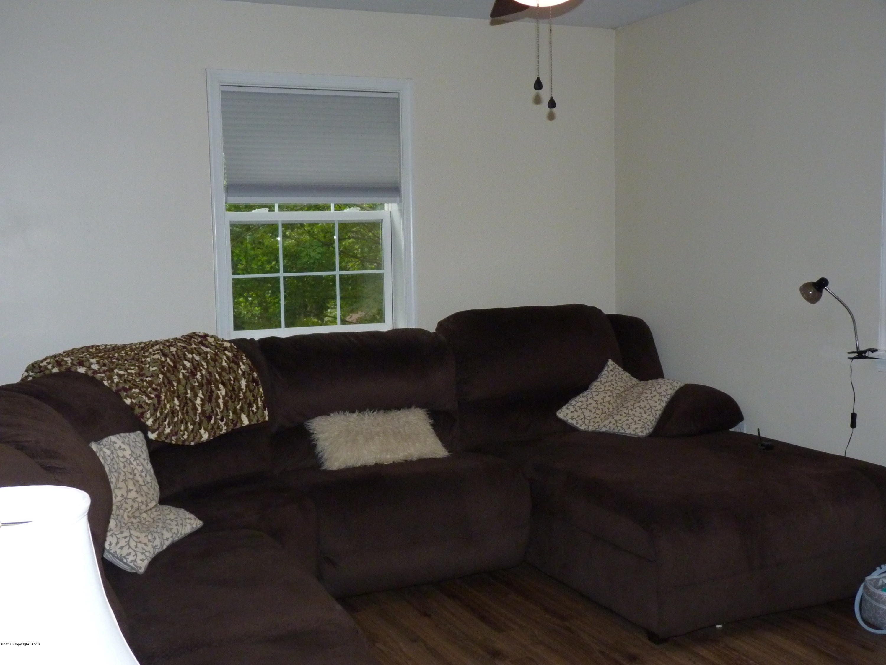 139 Fern Ridge Road Blakeslee, PA 18610 - Photo 9 of 19 a living room with furniture and a window