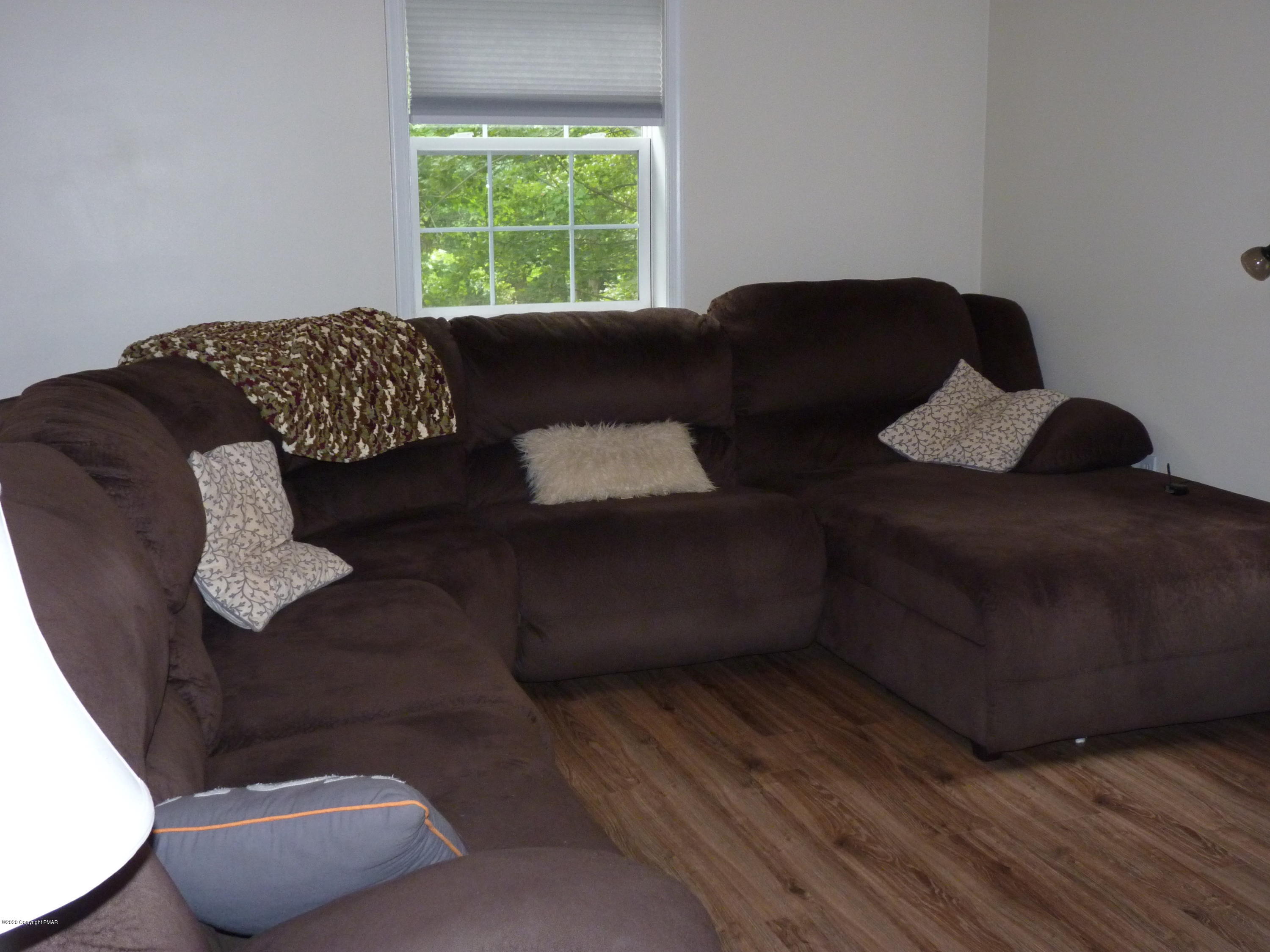 139 Fern Ridge Road Blakeslee, PA 18610 - Photo 10 of 19 a living room with furniture and a window