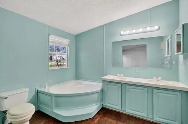 a bathroom with a toilet sink and a mirror