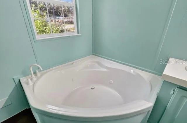 a white bath tub sitting in a bathroom