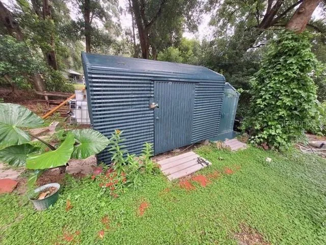 a backyard of a house with lots of green space