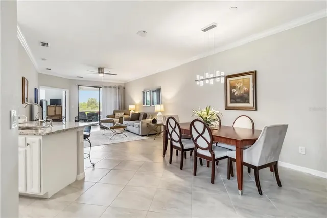 a dining room with furniture and a clock