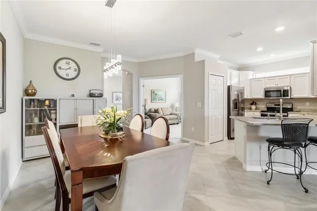 a kitchen with stainless steel appliances a stove sink microwave and refrigerator