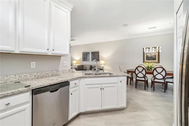 a view of kitchen with windows and workspace