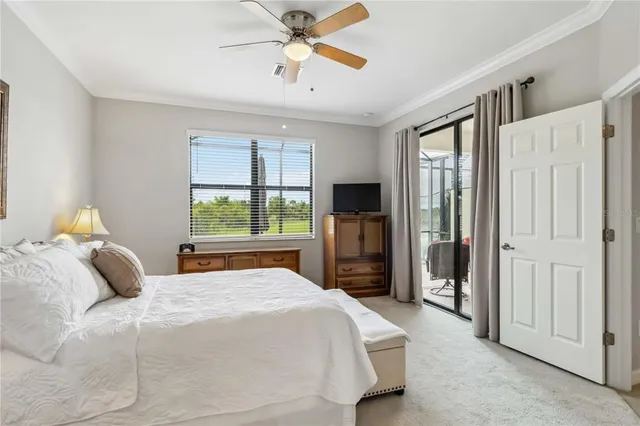 a white bath tub sitting in a bathroom next to a window