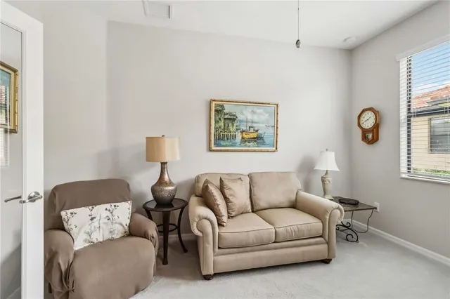 a bedroom with a bed and lamp