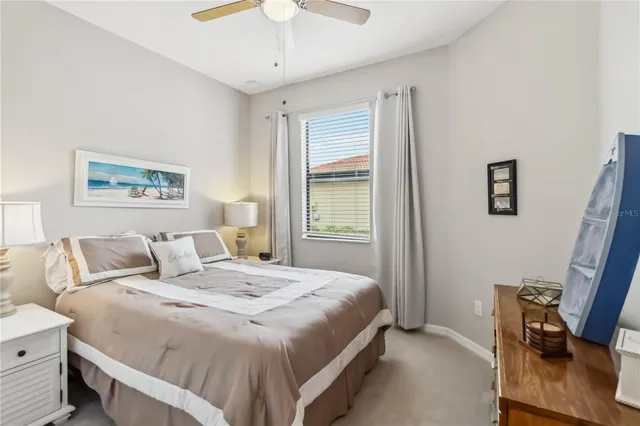 a dining room with furniture a chandelier and window