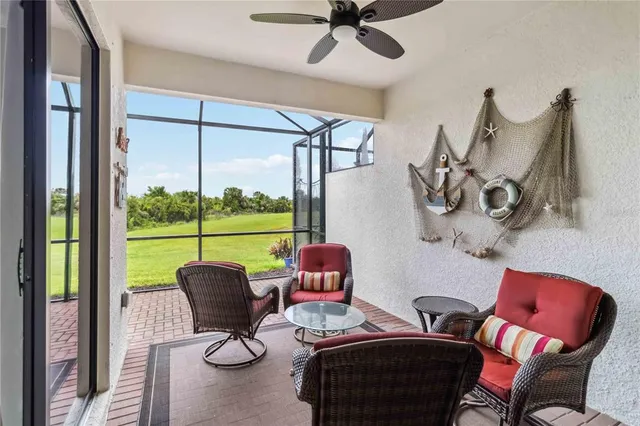 a view of a house with a big yard and large trees