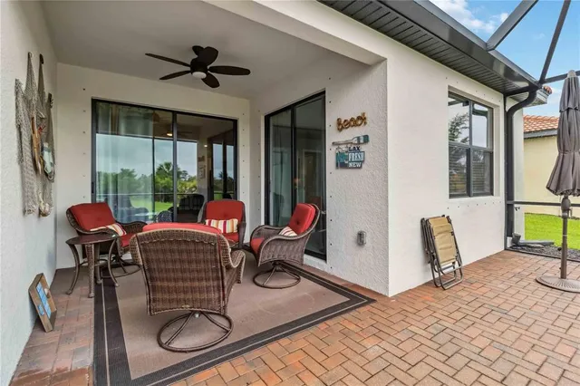 an aerial view of a house with a yard and potted plants