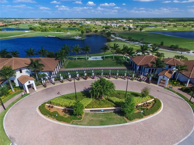 an aerial view of a houses with outdoor space and street view