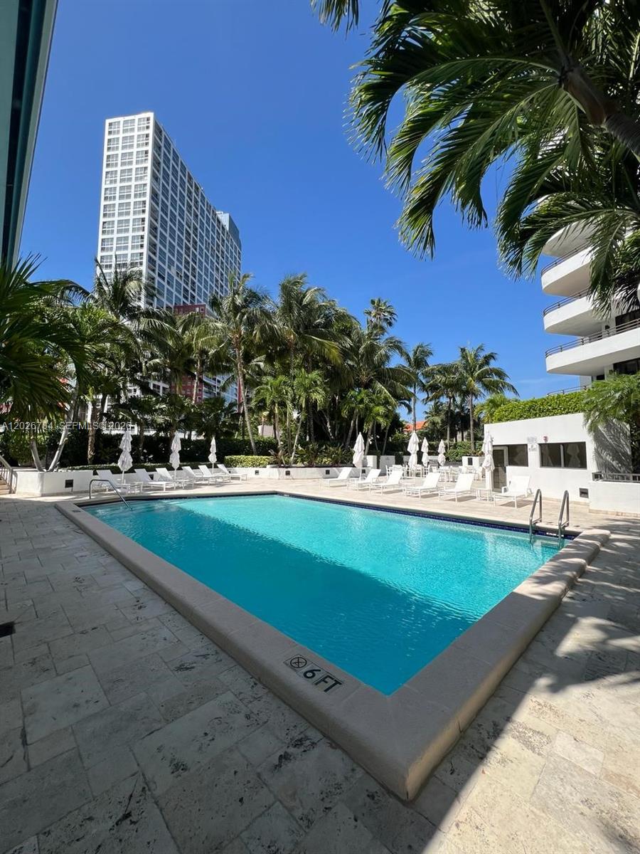 151 Southeast 15th Road, Unit 601 Miami, FL 33129 - Photo 34 of 36 a view of a swimming pool with a yard