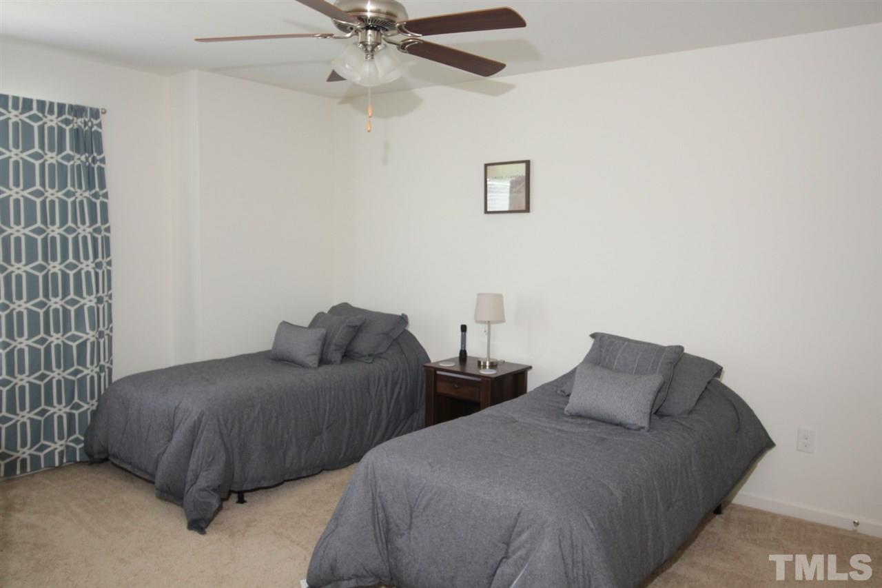 3600 Marble Ridge Lane Raleigh, NC 27610 - Photo 15 of 23 a bedroom with bed and a window