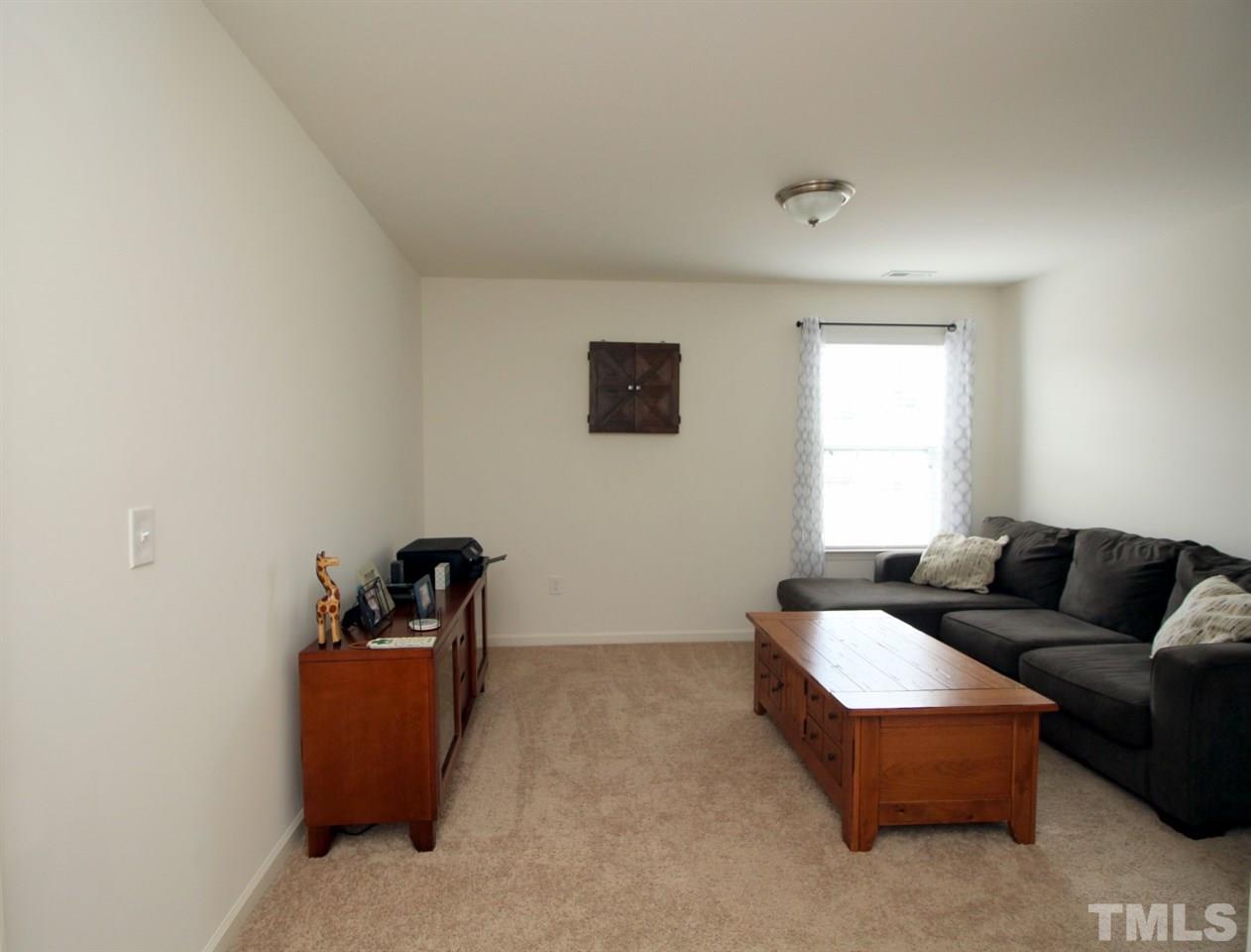 3600 Marble Ridge Lane Raleigh, NC 27610 - Photo 18 of 23 a living room with furniture and a window