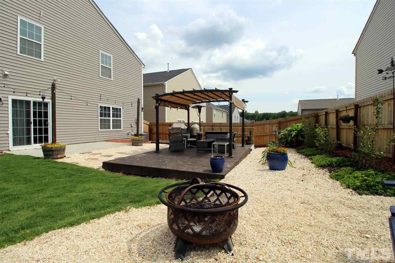 3600 Marble Ridge Lane Raleigh, NC 27610 - Photo 21 of 23 a view of a patio with couches chairs and a fire pit