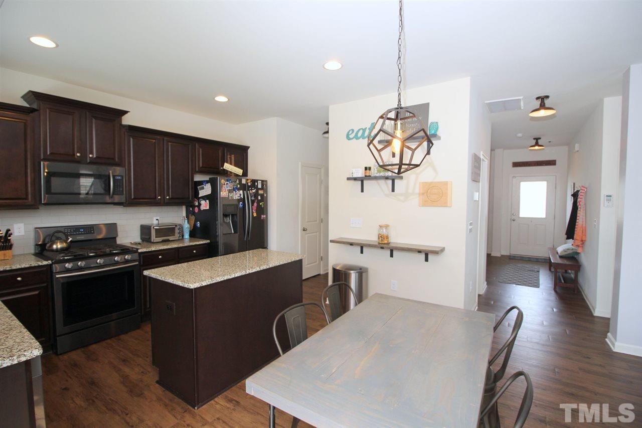 3600 Marble Ridge Lane Raleigh, NC 27610 - Photo 5 of 23 a kitchen with refrigerator a stove and cabinets