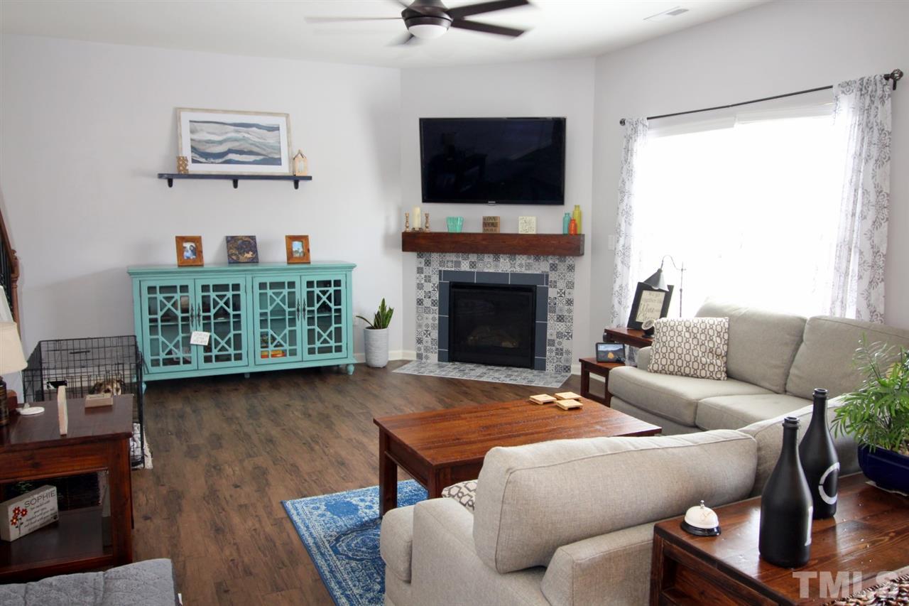 3600 Marble Ridge Lane Raleigh, NC 27610 - Photo 6 of 23 a living room with furniture and a fireplace