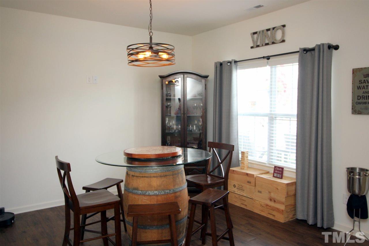 3600 Marble Ridge Lane Raleigh, NC 27610 - Photo 10 of 23 a view of a dining room with furniture window and wooden floor