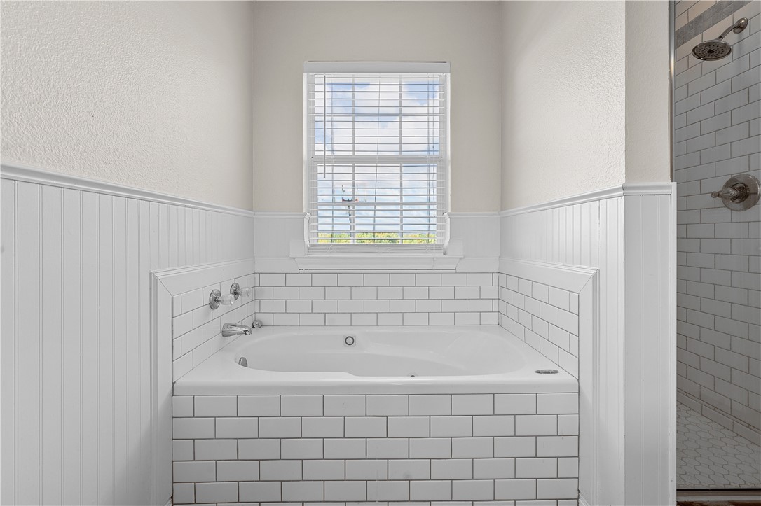 1312 North Rock Creek Road Waco, TX 76708 - Photo 34 of 46 a white bath tub sitting next to a window