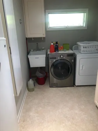 a utility room with dryer and washer